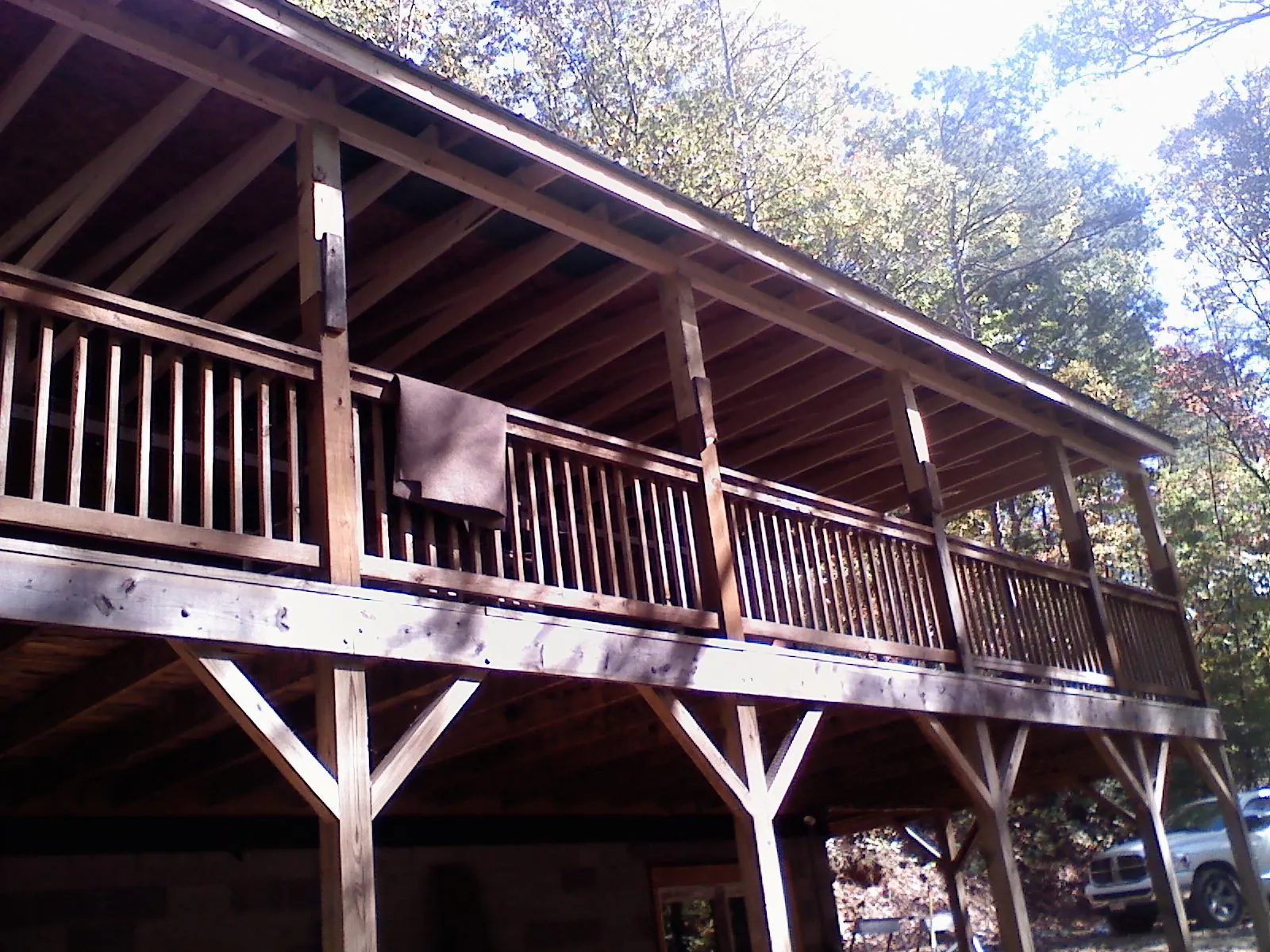 Timber framing under a new elevated porch and deck — Roof Leak Repair in Astoria by Roofing Brothers